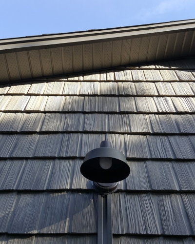 Professional vinyl siding installation on a residential property in Guelph, showcasing durability and modern aesthetic.